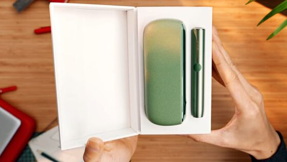 An IQOS ILUMA PRIME Holder and Pocket Charger in a box.