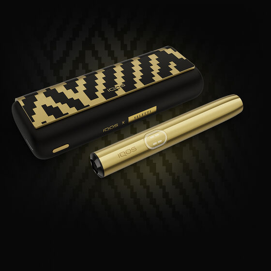 A moss green IQOS ILUMA device.