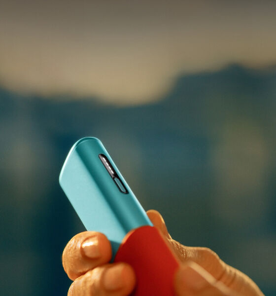 A Jade Green IQOS ILUMA PRIME Pocket Charger and Holder.