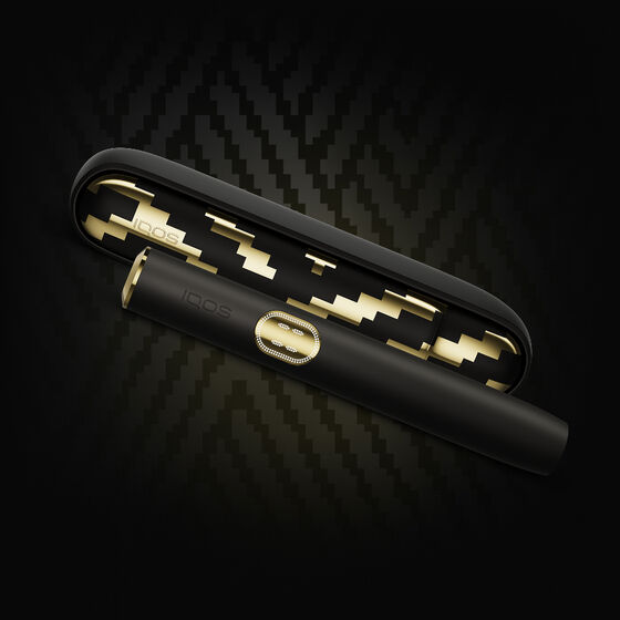 A moss green IQOS ILUMA device.