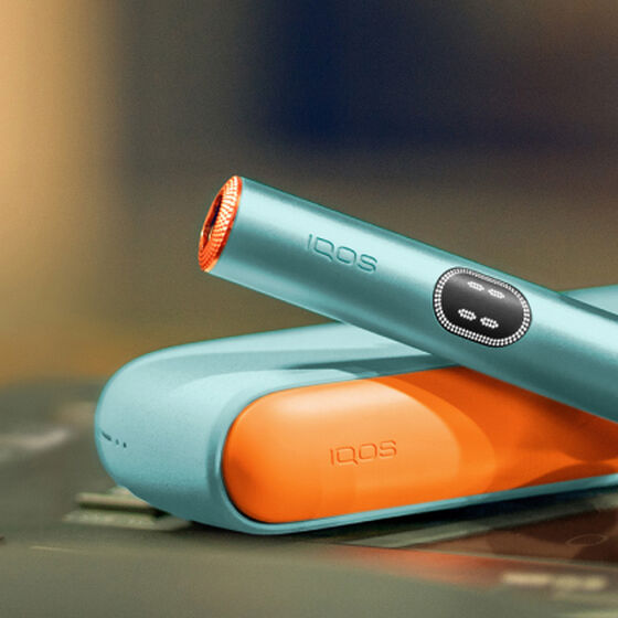 An IQOS ILUMA PRIME Holder and Pocket Charger in a box.