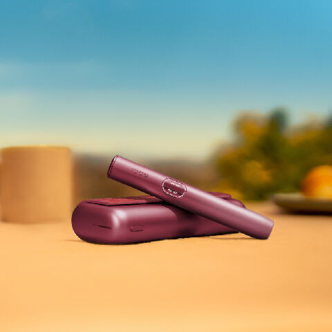 An obsidian black IQOS ILUMA device.