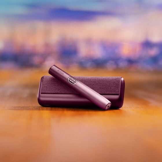 A moss green IQOS ILUMA device.