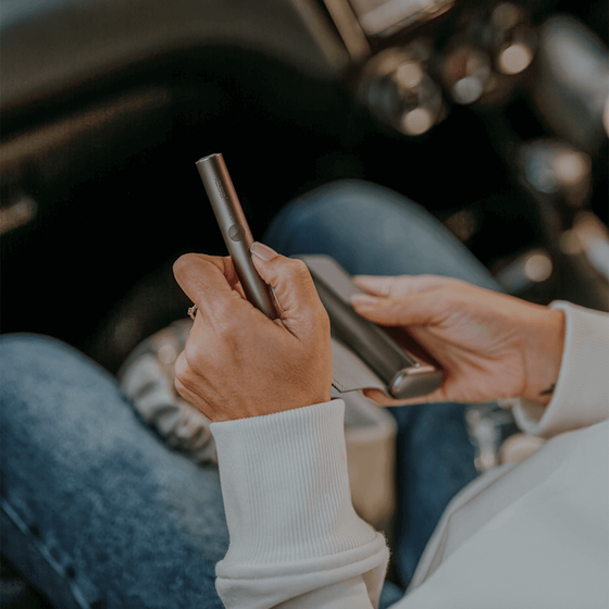 IQOS device in man's hands