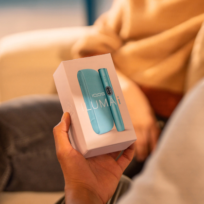 A jade green IQOS ILUMA PRIME Pocket Charger and Holder.