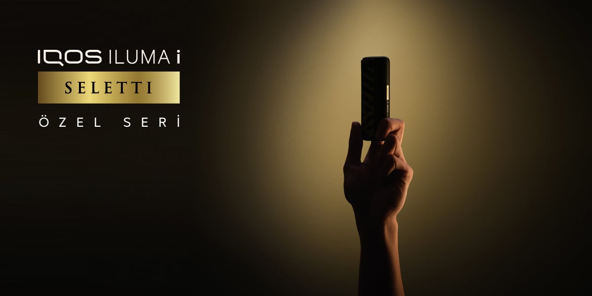 IQOS ILUMA i x Seletti Özel Seri - Yumuşak ışıklı arka plan ve gölgede kalan cihaz.